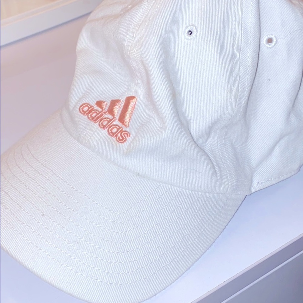 Women’s white Adidas fitted hat.